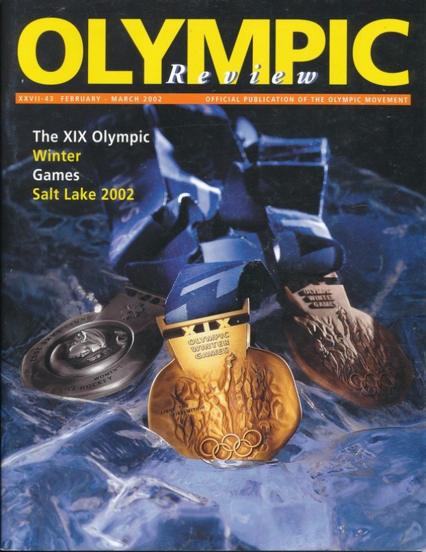 Titelbild der *Olympischen Zeitschrift* mit mehreren Medaillen in verschiedenen Größen und Farben.