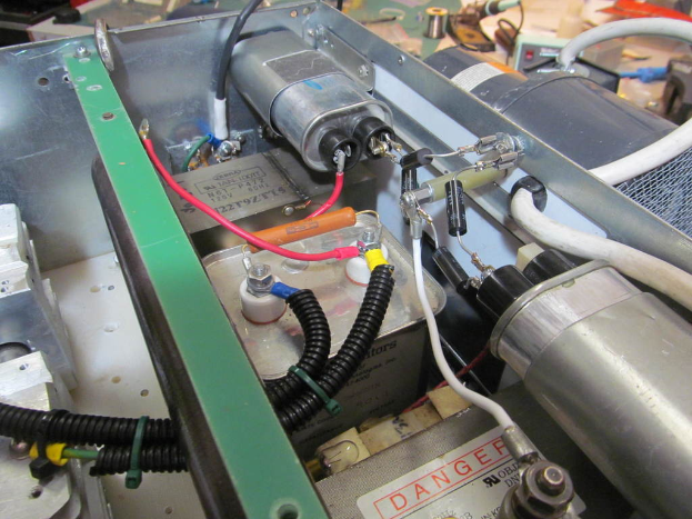 Equipment with various cables and nuts attached.