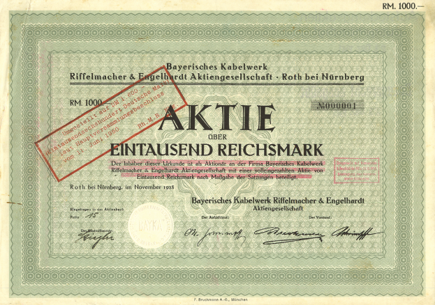 Ein altes deutsches Wertpapier mit einem roten Stempel, das Text enthält, der seinen Ursprung angibt.