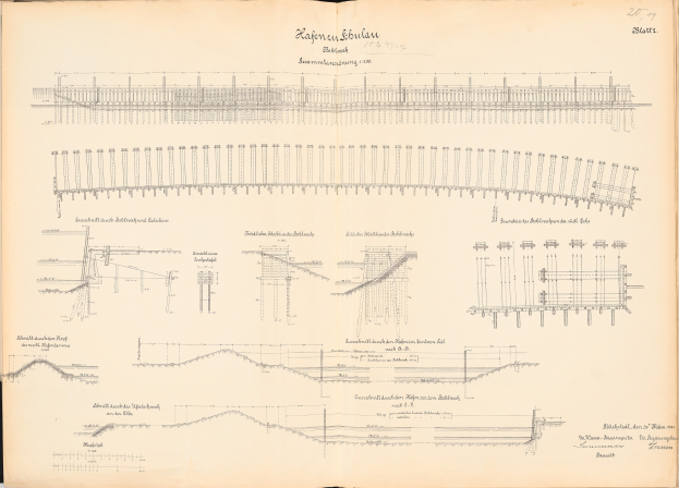 Offenes Buch mit detaillierten Zeichnungen und Texten eines Schienensystems, einschließlich einer Illustration der Eisenbahnschienen.