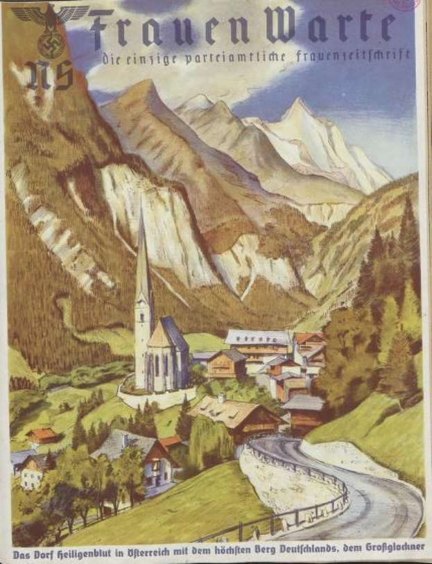 Ein altes deutsches Reiseplakat aus den 1930er Jahren, das eine kleine Stadt in den Bergen zeigt, mit Häusern, Bäumen und einer gewundenen Straße, sowie Text über die Stadt.